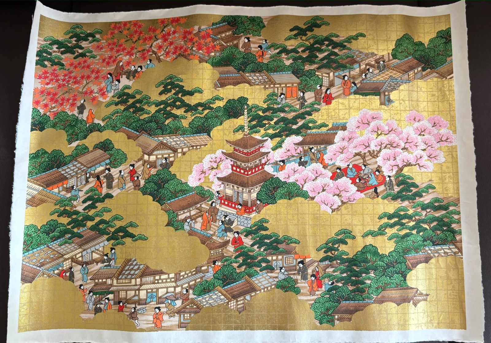 Gold-leaf painting of a pagoda and townspeople under cherry blossoms and autumn maples, Tokyo, Japan, photo 2 of 2