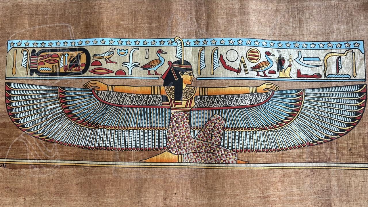 Papyrus painting of a winged goddess, likely Isis or Maat, with hieroglyphic borders, Luxor, Egypt